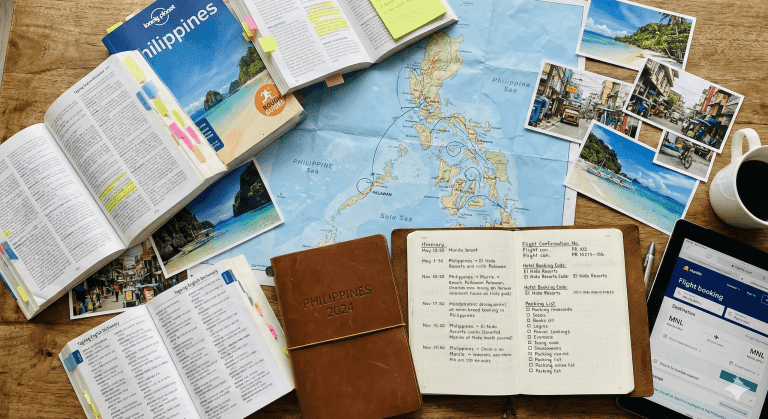 A pile of guides, pics and maps for travel planning